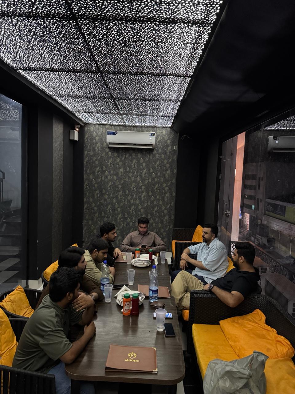 Nasmak Labs team collaborating in the office